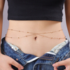 A Woman Wearing A Sexy Belly Chain with Round Beaded Chains Stacked on Top of Each Other in A Street Style
