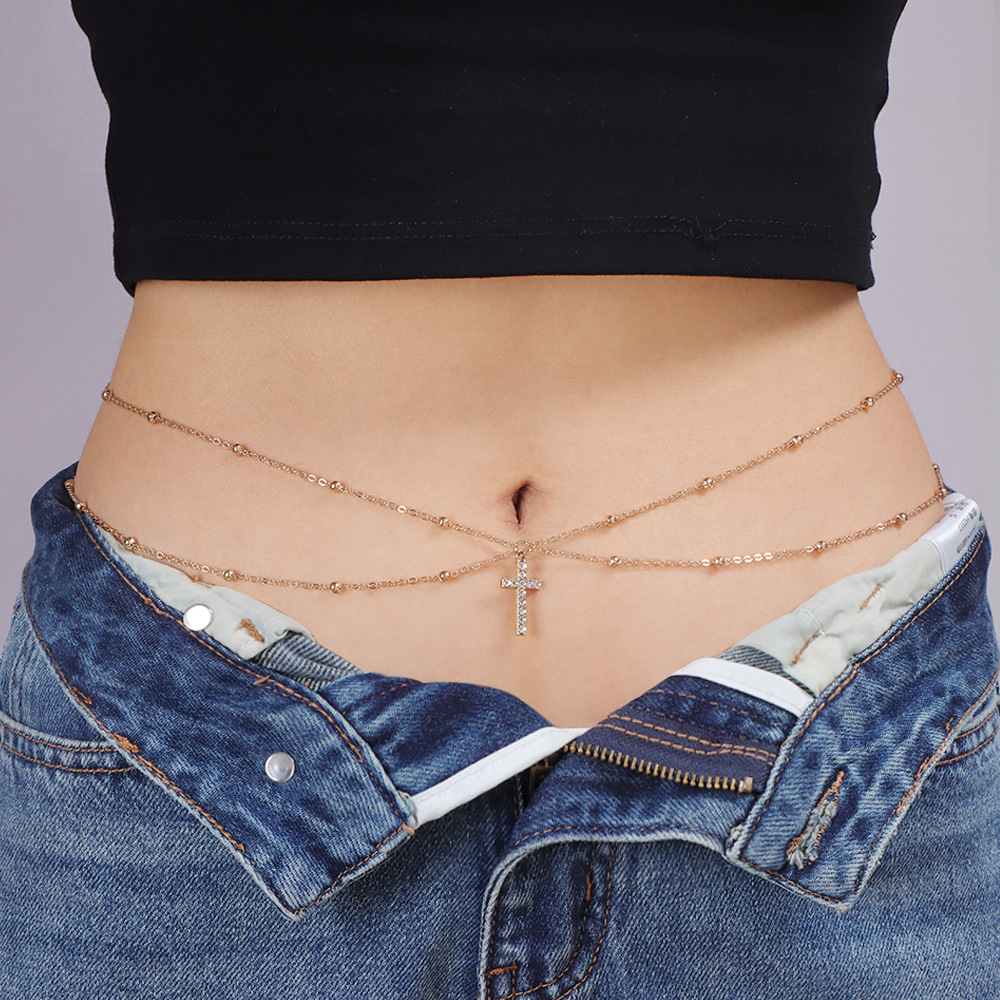 A Woman Wearing A Sexy Belly Chain with Round Beaded Chains Stacked on Top of Each Other in A Street Style